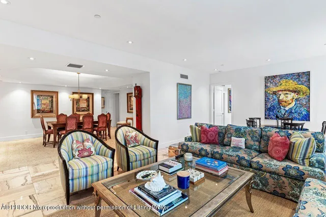a view of a dining room with furniture and a window