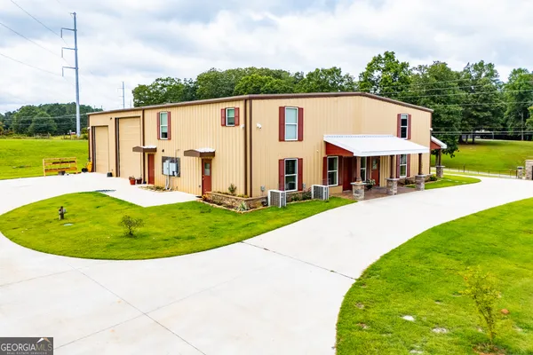 a kitchen with stainless steel appliances kitchen island granite countertop a refrigerator and a stove top oven