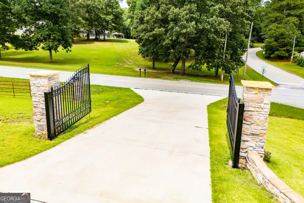 a kitchen with white cabinets and refrigerator
