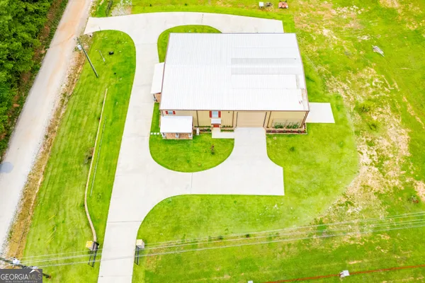 a view of a dining room with furniture wooden floor and chandelier