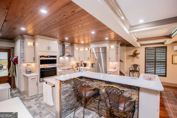 a bathroom with a glass shower door