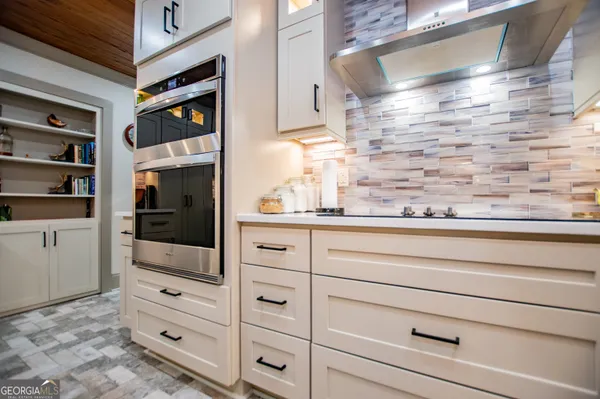 a living room with furniture and a mirror