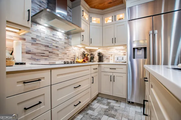 a view of a room with lots of gym equipment