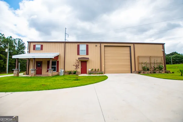 a view of a backyard with swimming pool