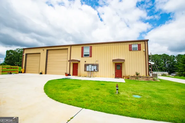 a utility room with cabinets washer and dryer