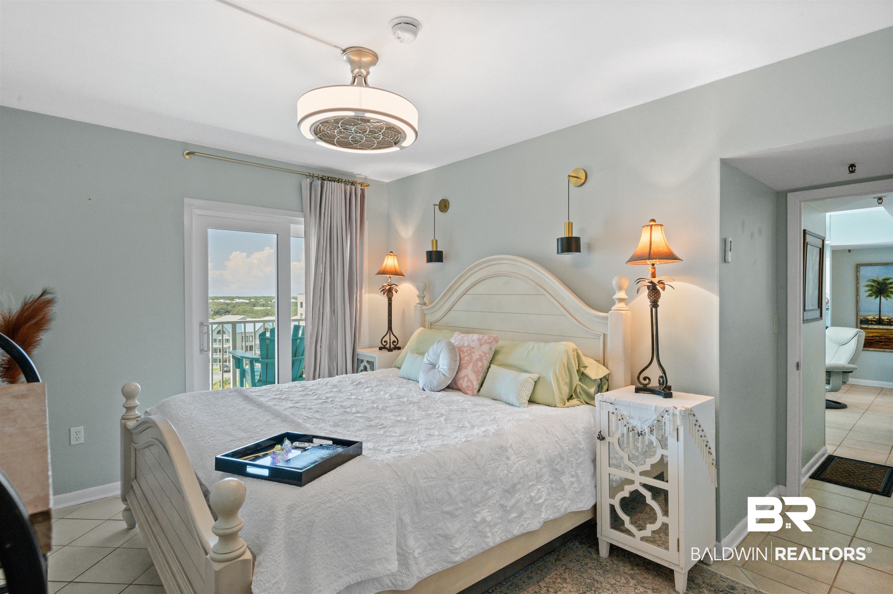 375 Plantation Road, Unit 5610 Gulf Shores, AL 36542 - Photo 7 of 33 Bedroom featuring light tile patterned flooring and access to exterior