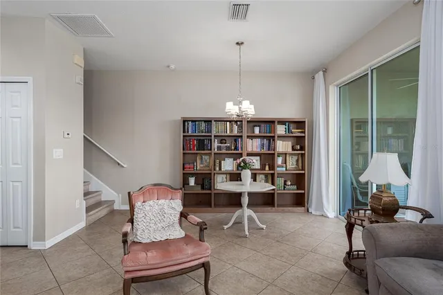 a kitchen with kitchen island granite countertop a sink stove refrigerator and cabinets
