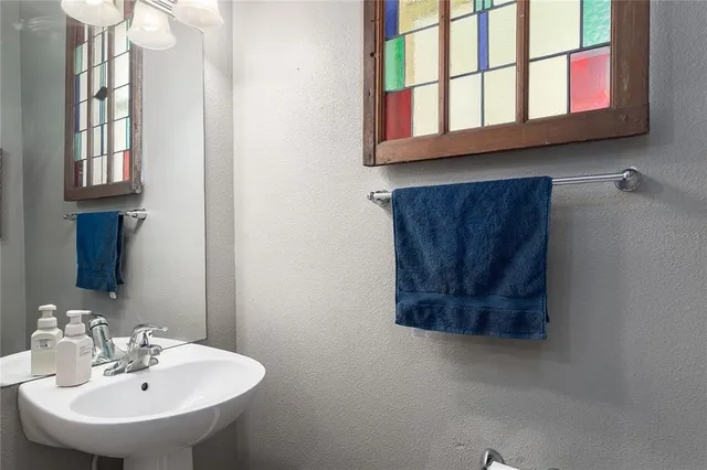 a bathroom with a sink and a mirror
