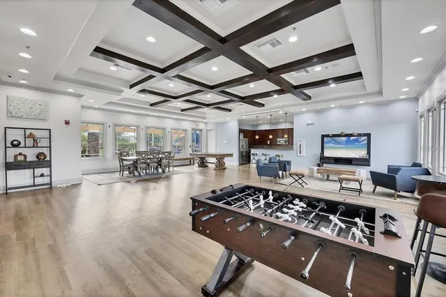 a kitchen with kitchen island granite countertop a sink a center island stainless steel appliances and cabinets