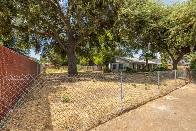 a view of a house with a tree