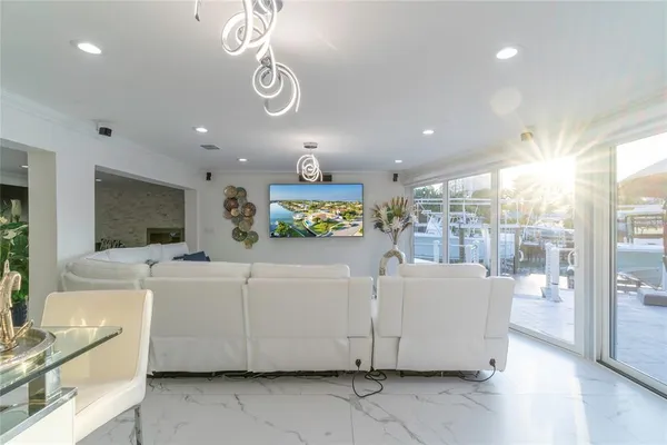 a large white kitchen with a large window