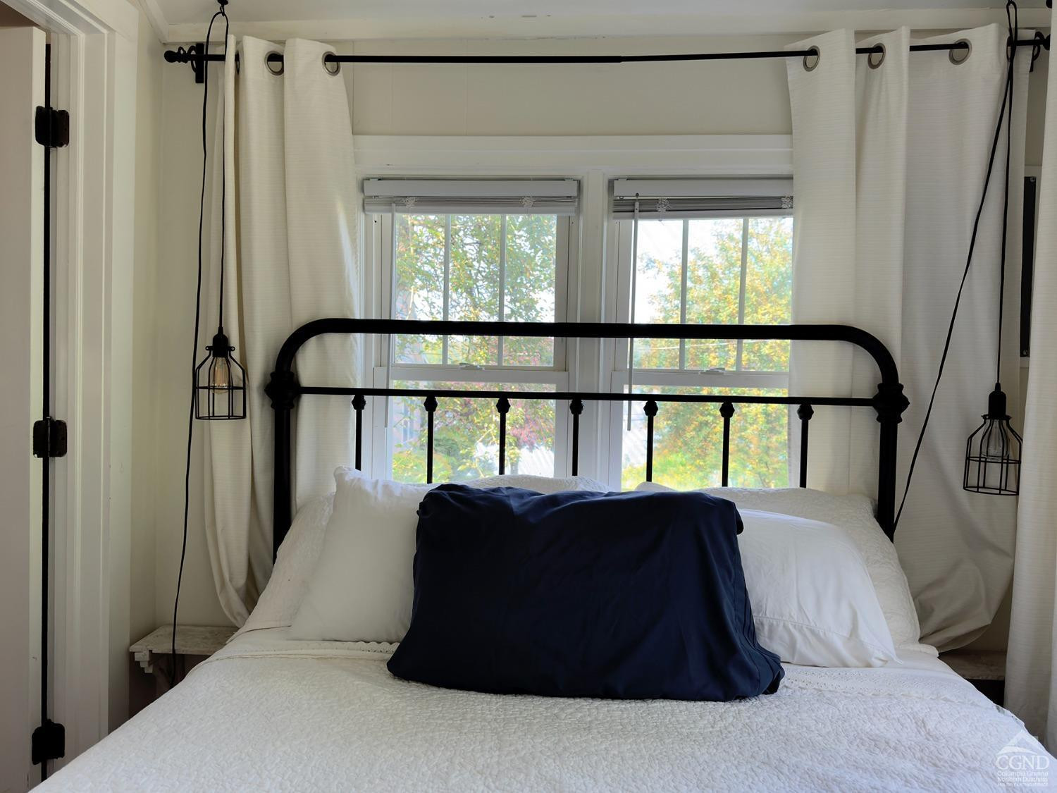 7 Pheasant Road Craryville, NY 12521 - Photo 15 of 26 a bedroom with a bed and a large window