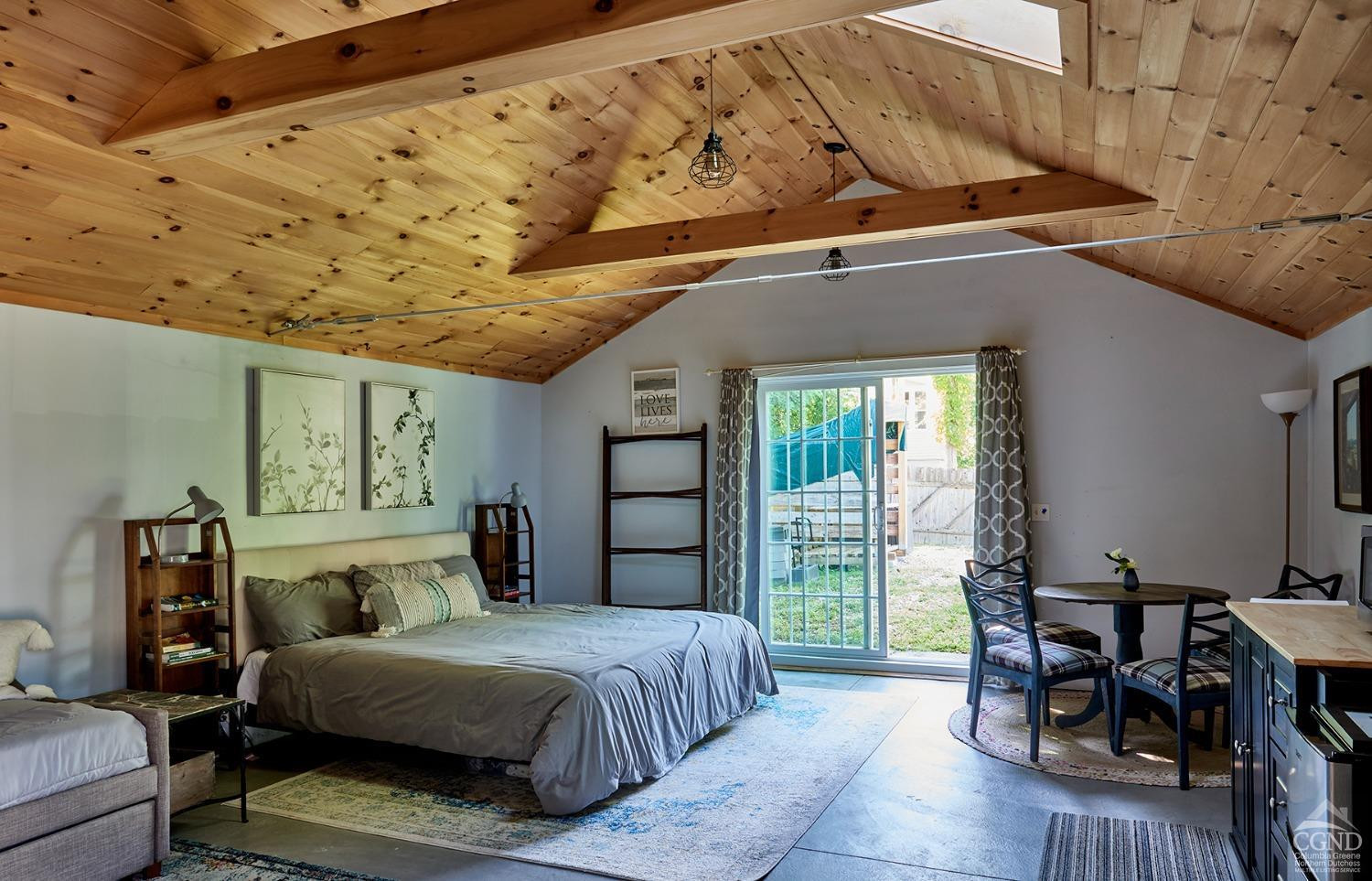 7 Pheasant Road Craryville, NY 12521 - Photo 19 of 26 a bedroom with a bed and wooden floor