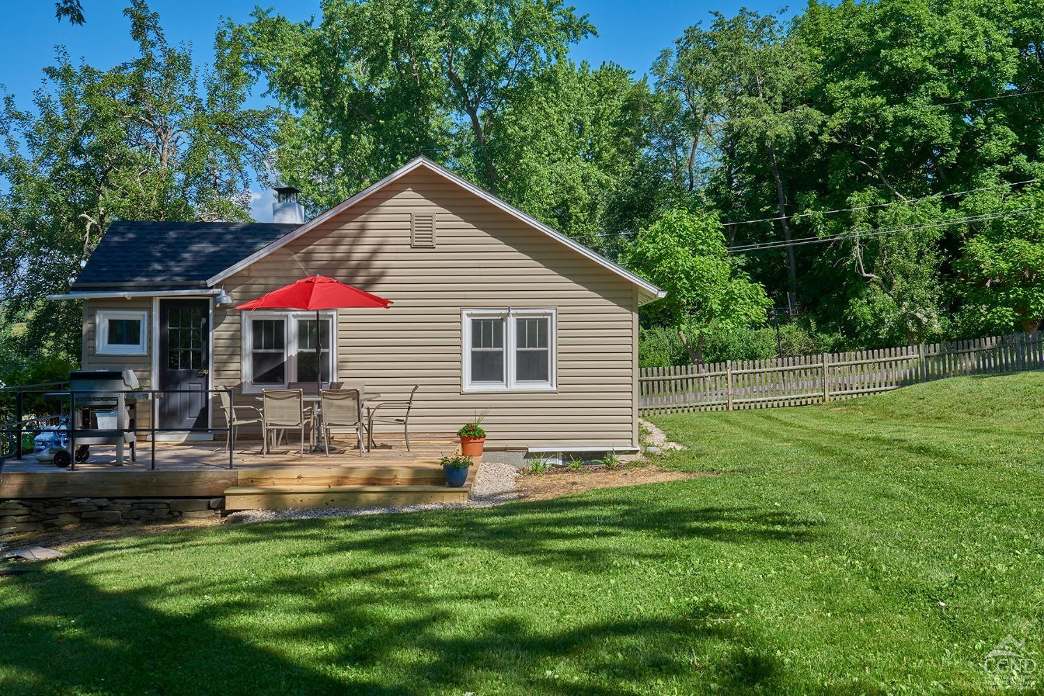 7 Pheasant Road Craryville, NY 12521 - Photo 2 of 26 a backyard of a house with table and chairs