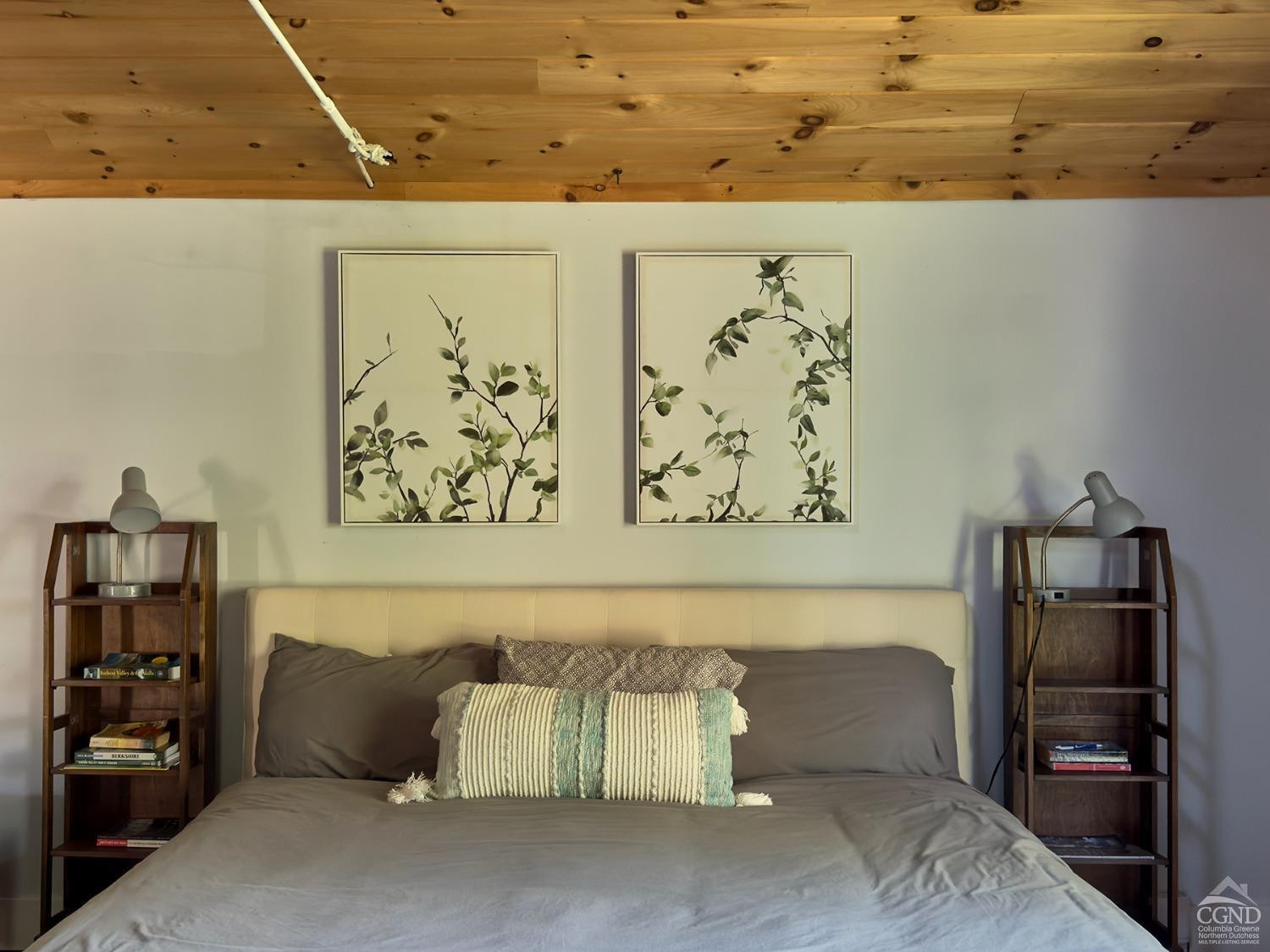 7 Pheasant Road Craryville, NY 12521 - Photo 21 of 26 a bedroom with a bed and painting on the wall