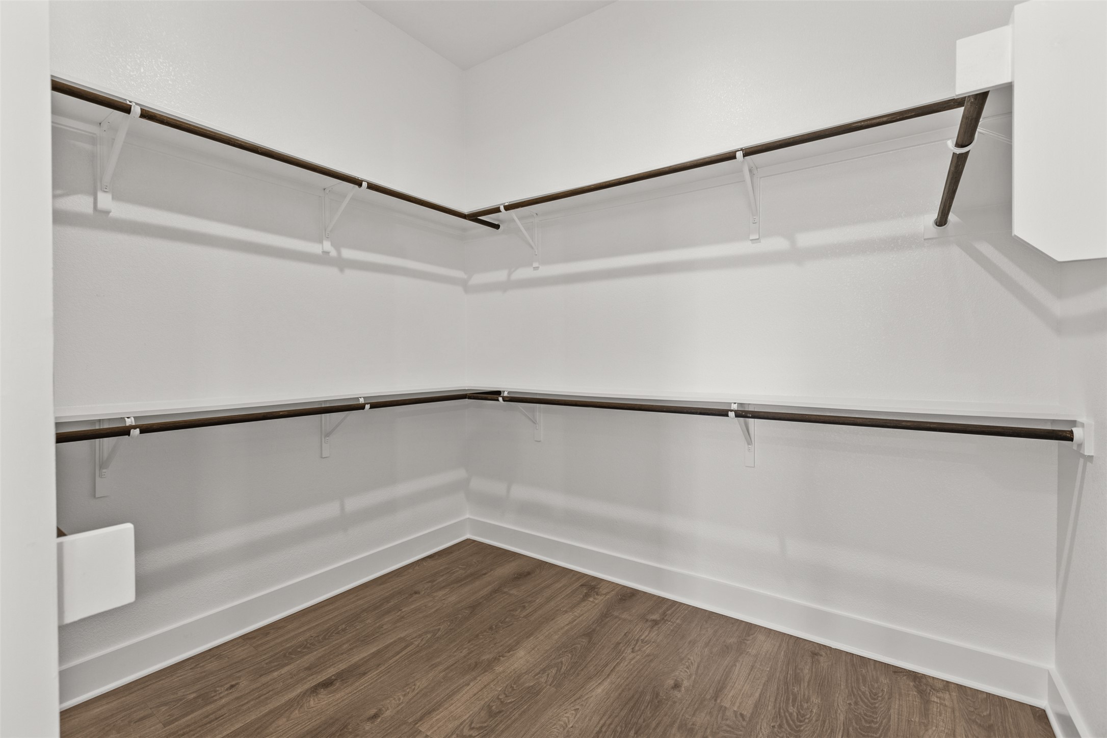 1420 Barth Road Dale, TX 78616 - Photo 21 of 37 A spacious walk-in closet with ample hanging space and durable flooring.