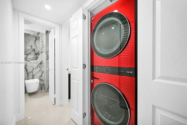 a utility room with dryer and washer