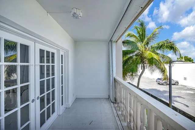 a view of balcony with a potted plant