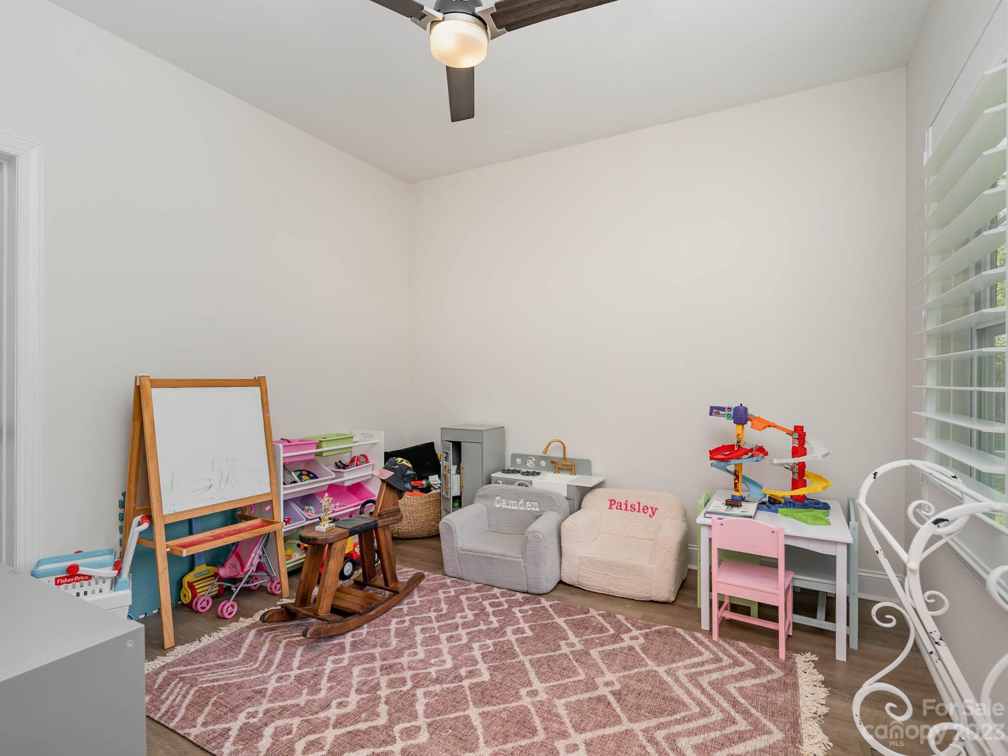 162 Niven Road Lancaster, SC 29720 - Photo 11 of 29 a bedroom with furniture and a chandelier
