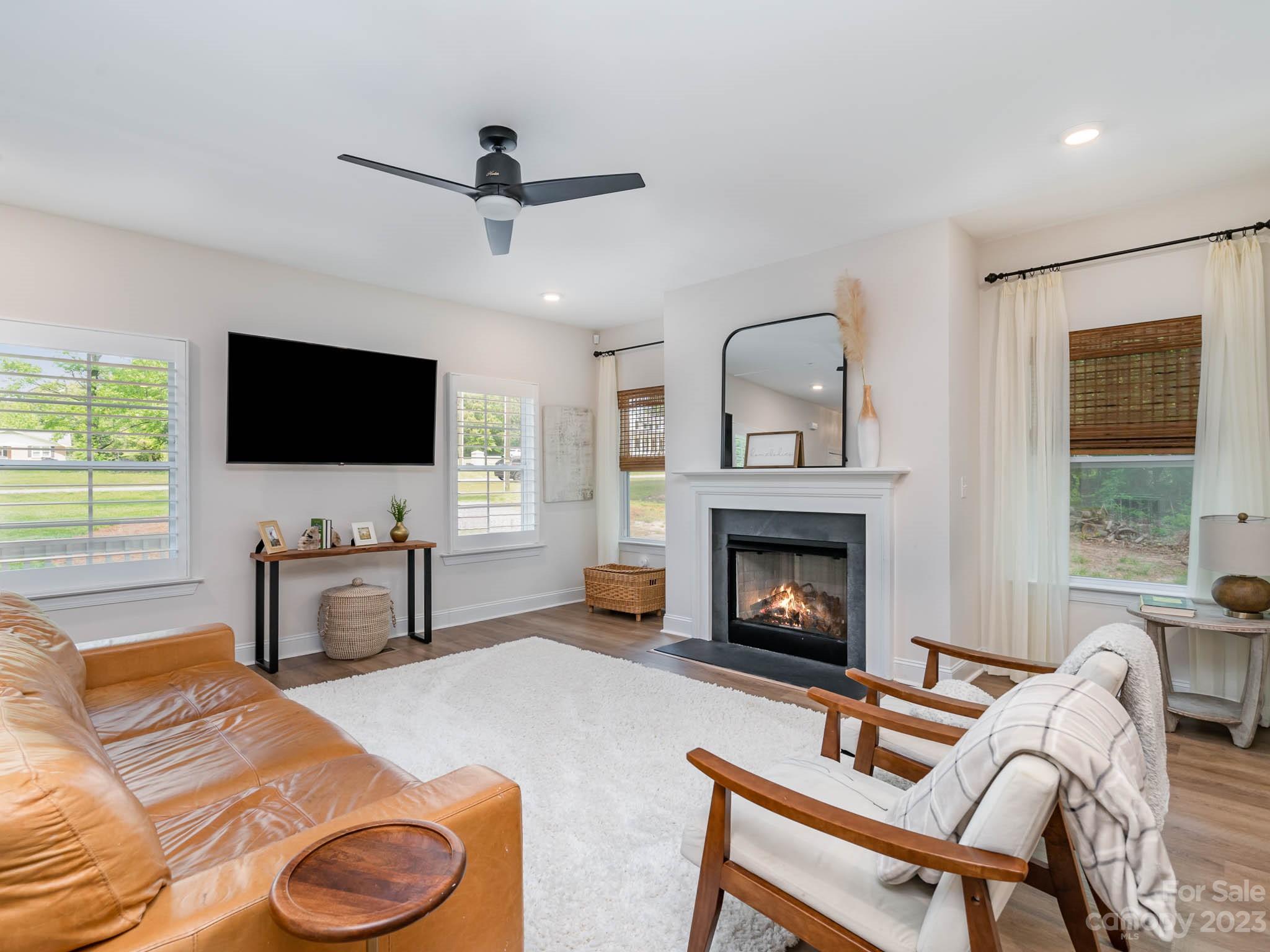 162 Niven Road Lancaster, SC 29720 - Photo 3 of 29 a living room with furniture and a fireplace