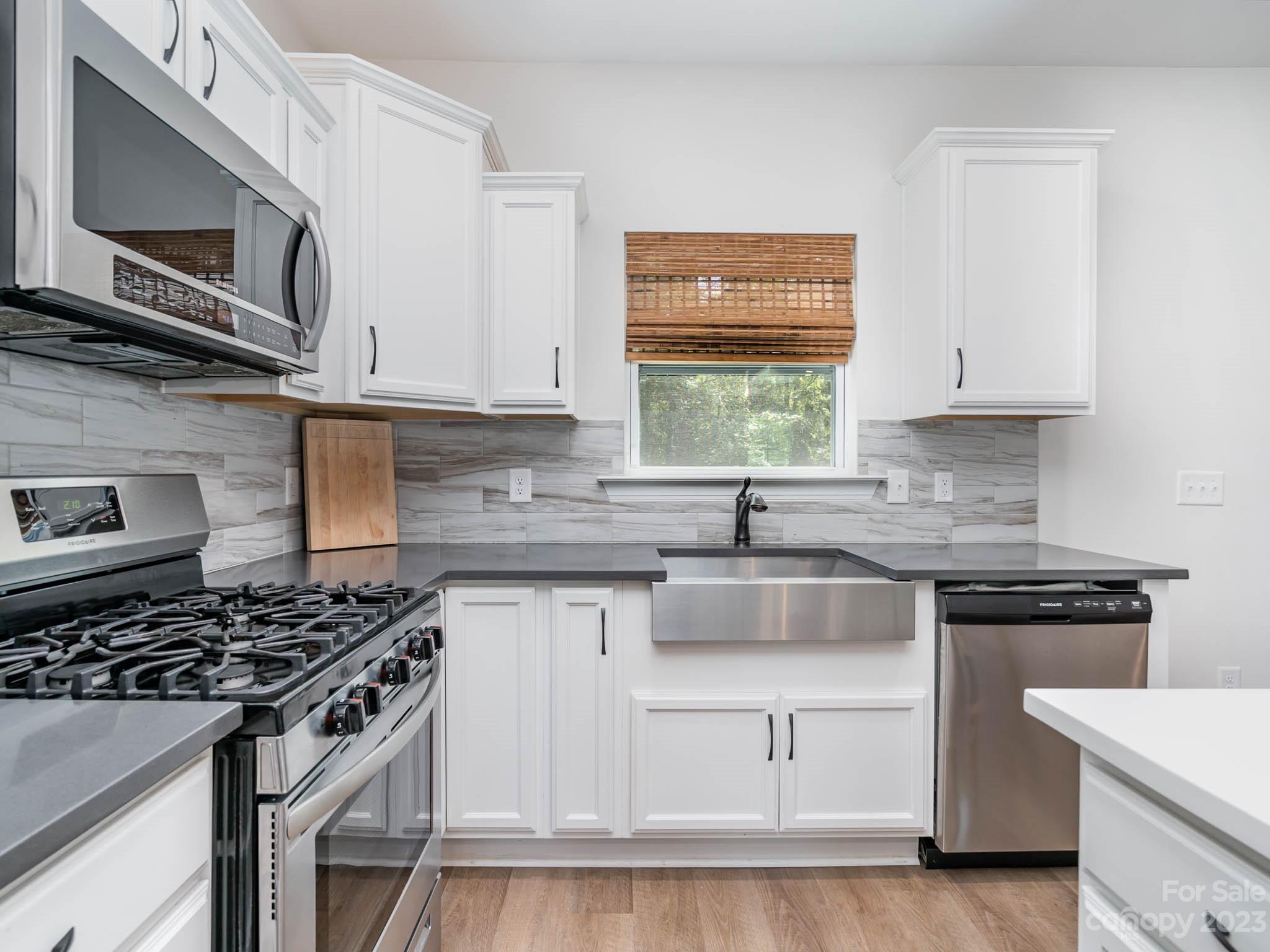 162 Niven Road Lancaster, SC 29720 - Photo 8 of 29 a kitchen with white cabinets and appliances