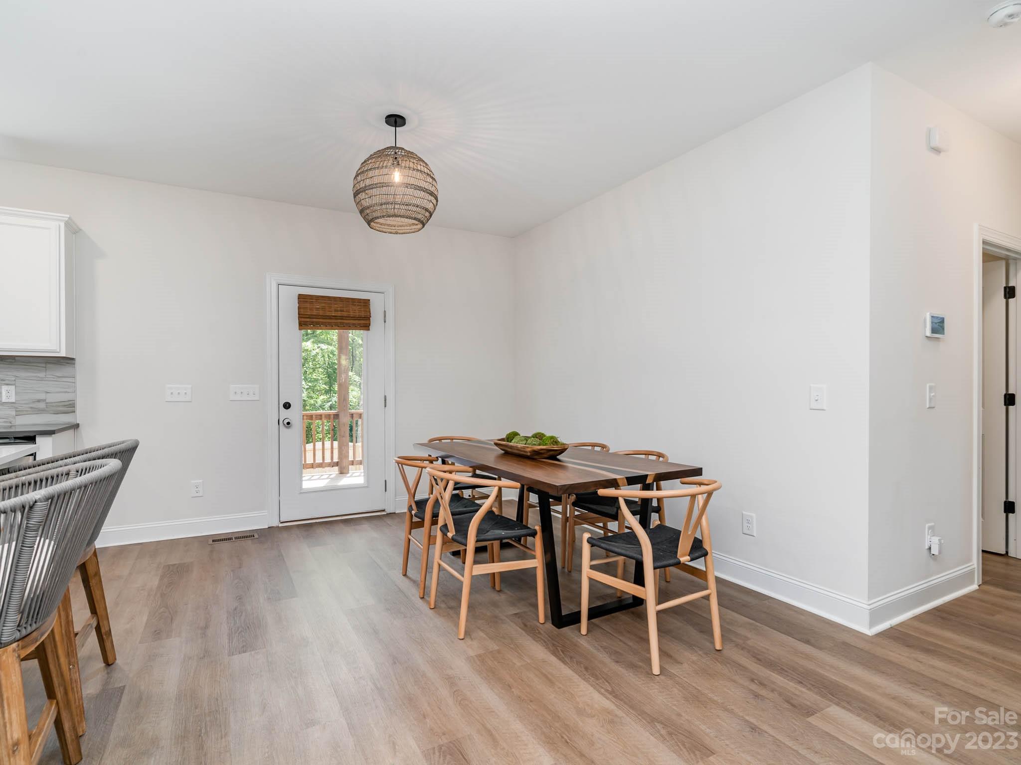 162 Niven Road Lancaster, SC 29720 - Photo 9 of 29 a view of a dining room with furniture and wooden floor