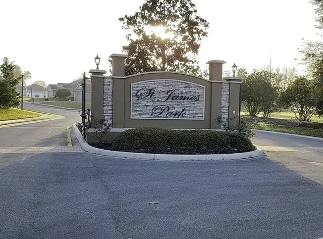 a view of a street with a building and a street sign