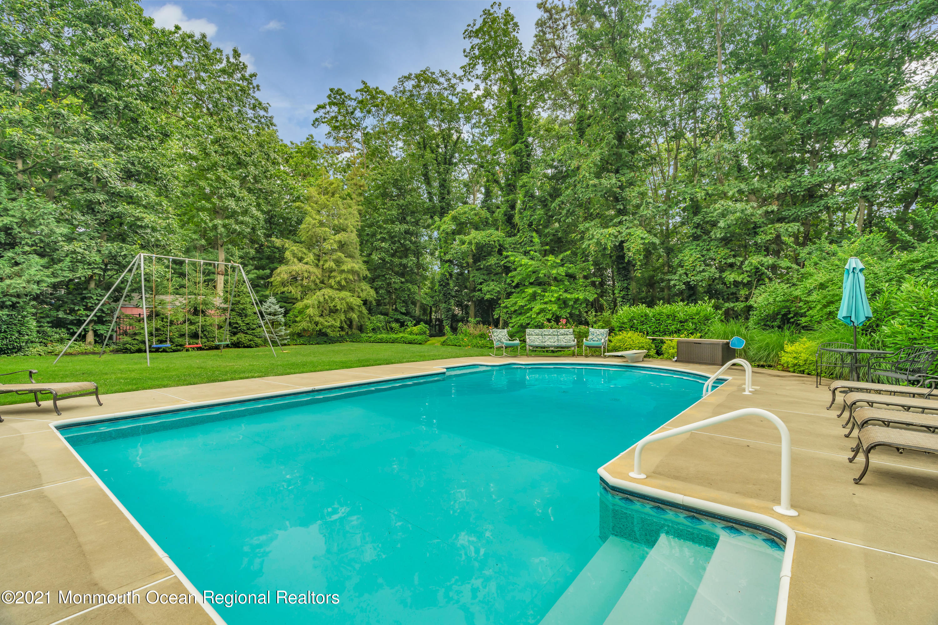 8 Partree Road Jackson, NJ 08527 - Photo 1 of 35 a view of a swimming pool with lawn chairs and plants