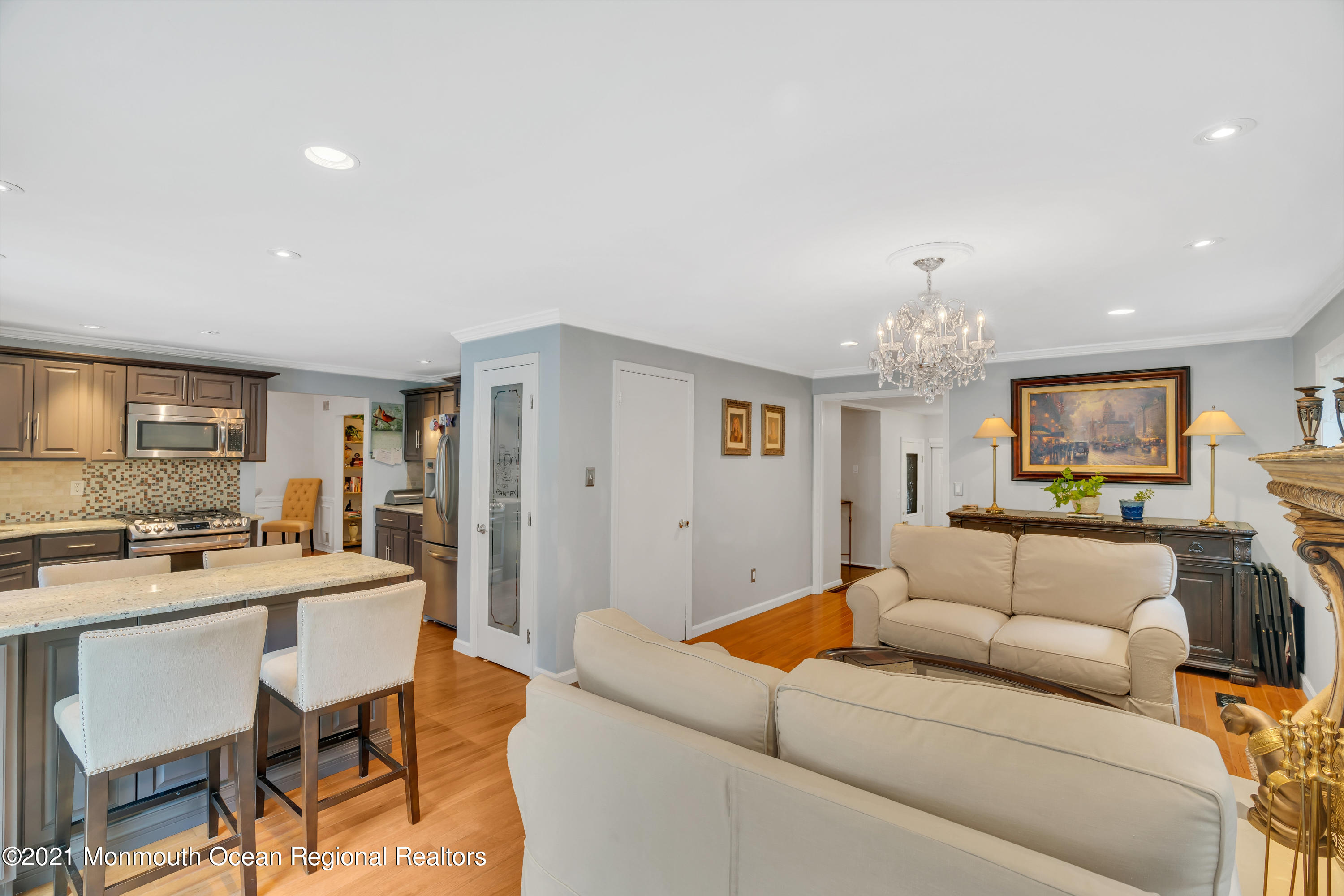 8 Partree Road Jackson, NJ 08527 - Photo 11 of 35 a living room with furniture and a chandelier