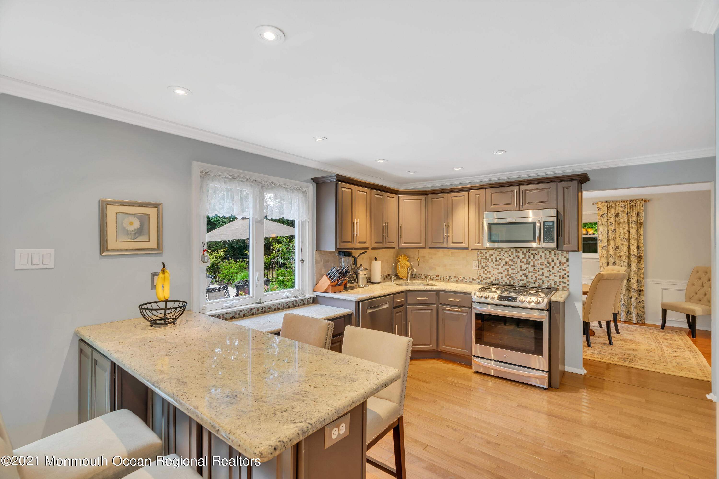 8 Partree Road Jackson, NJ 08527 - Photo 12 of 35 a kitchen with a stove a sink dishwasher and a refrigerator with wooden floor