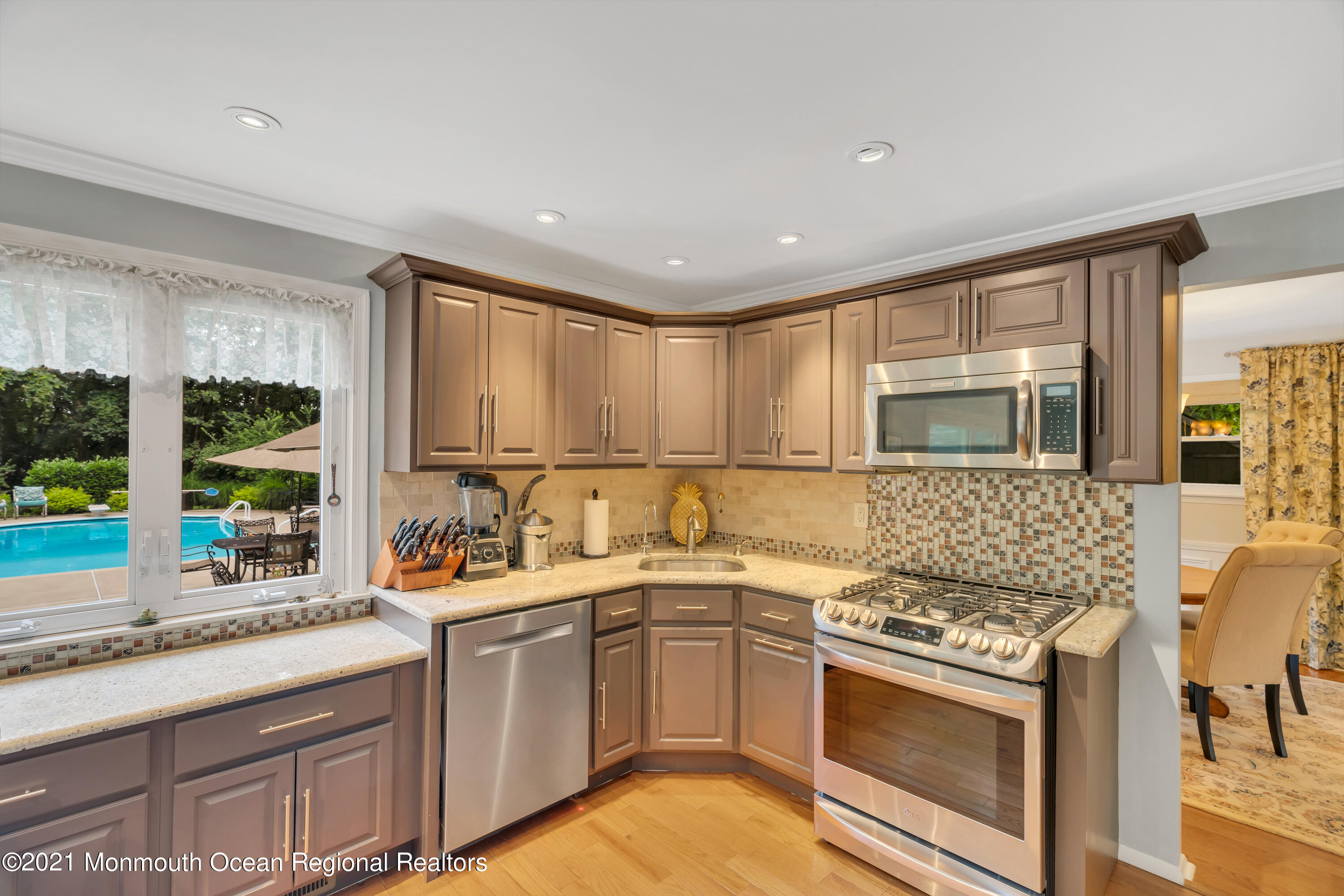8 Partree Road Jackson, NJ 08527 - Photo 13 of 35 a kitchen with a sink stove top oven and cabinets