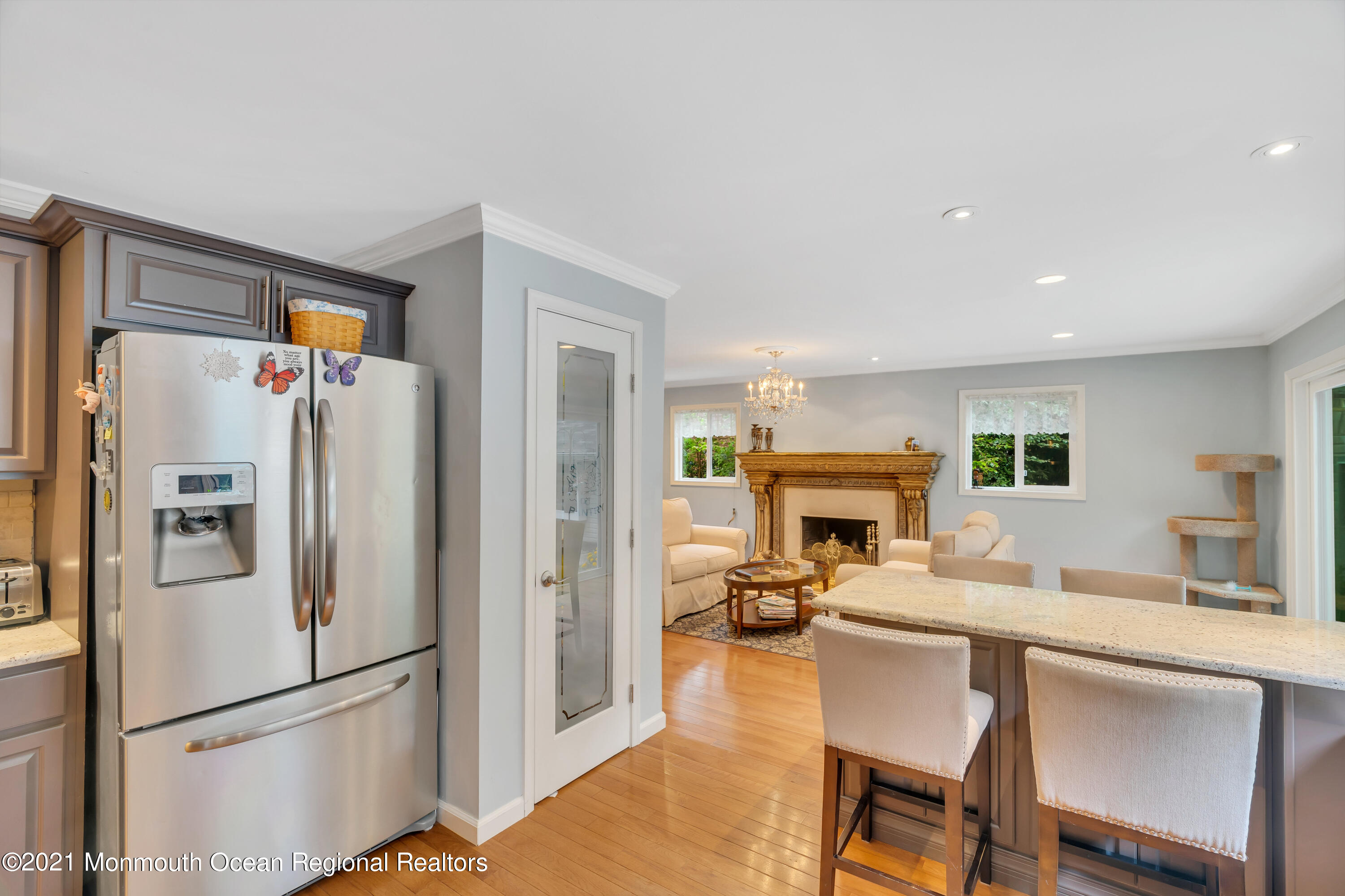 8 Partree Road Jackson, NJ 08527 - Photo 14 of 35 a kitchen with a refrigerator a stove a dining table and chairs