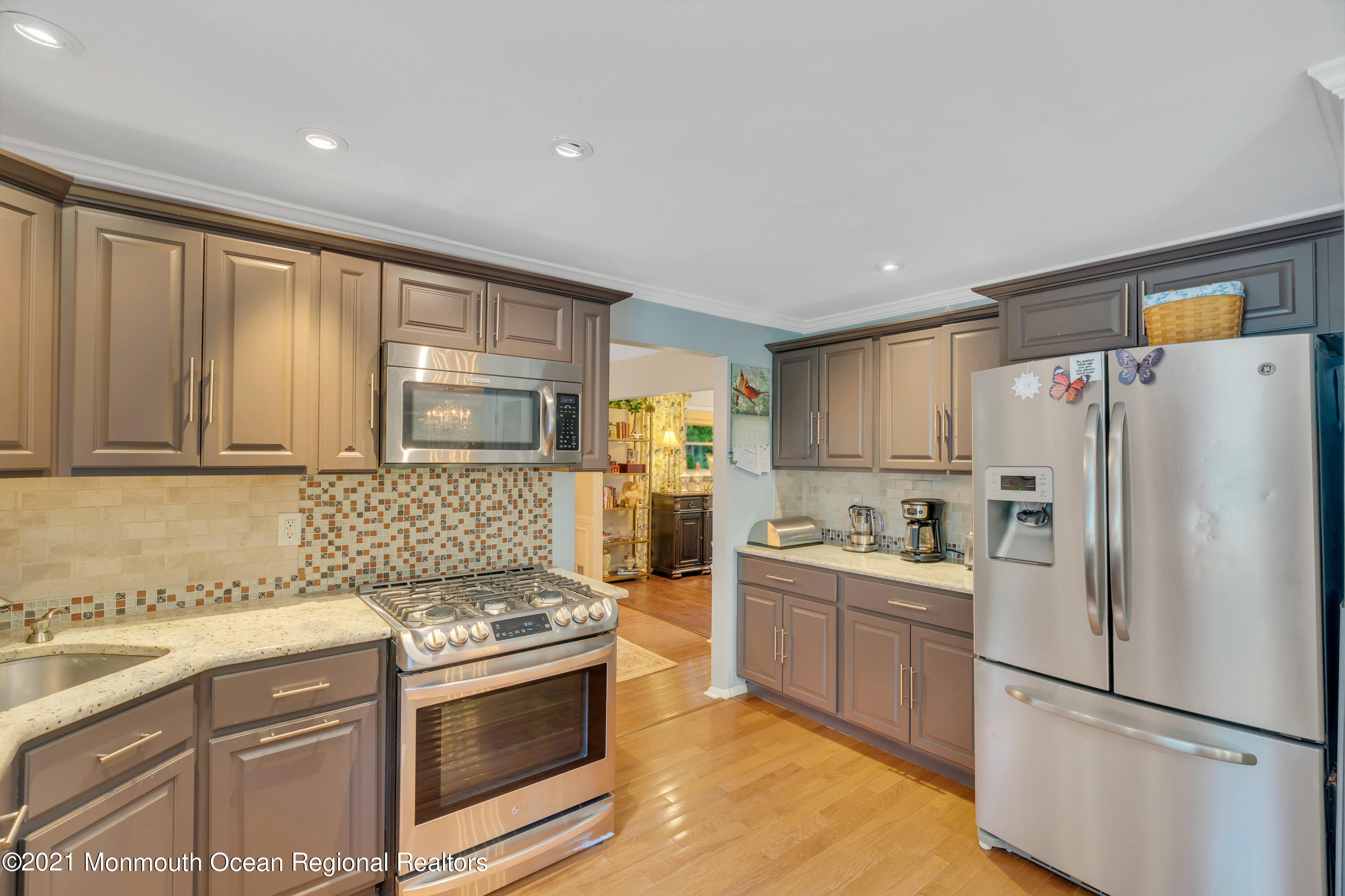 8 Partree Road Jackson, NJ 08527 - Photo 15 of 35 a kitchen with a sink a refrigerator and cabinets