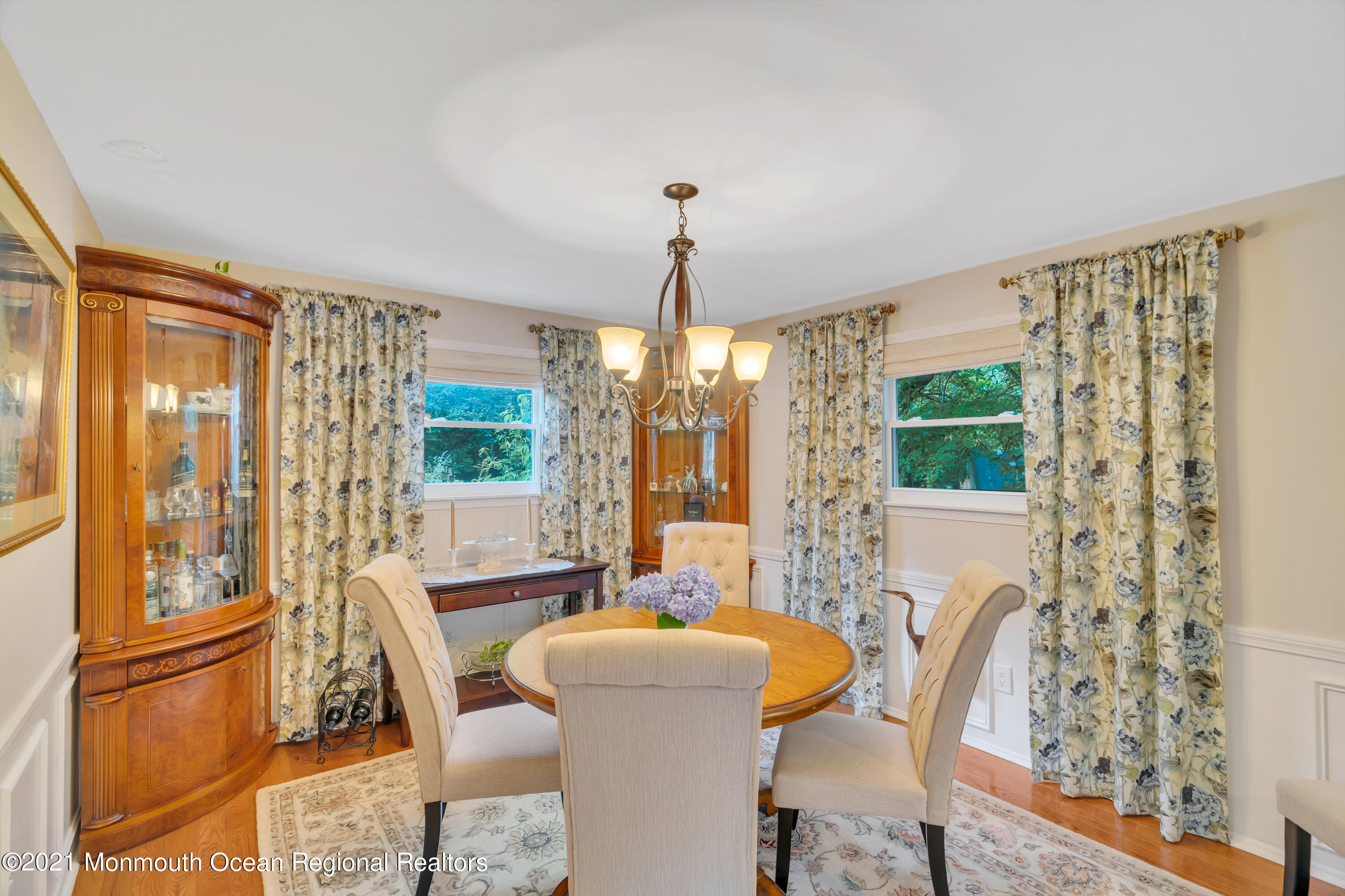 8 Partree Road Jackson, NJ 08527 - Photo 16 of 35 a dining room with furniture a chandelier and wooden floor
