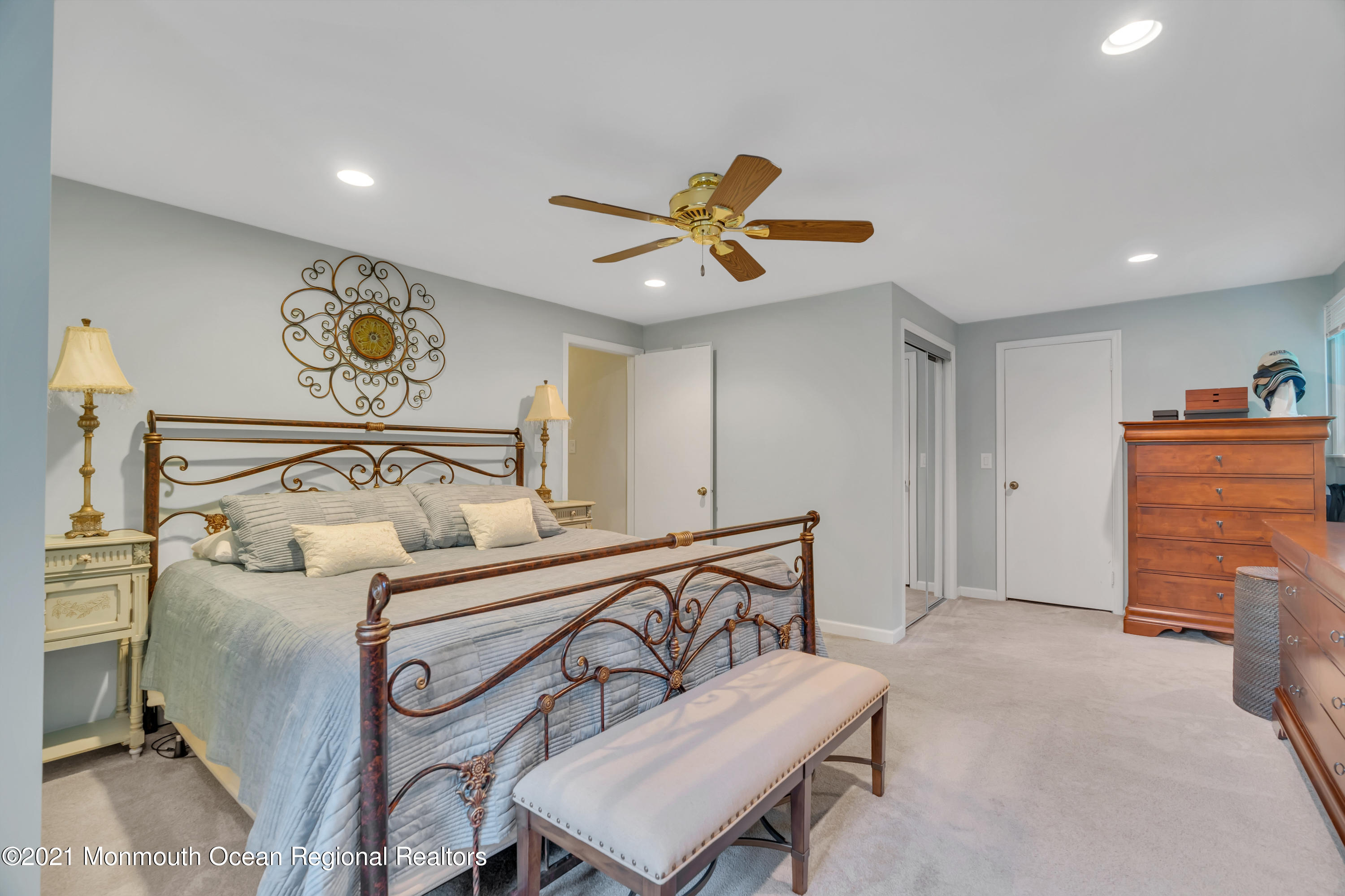 8 Partree Road Jackson, NJ 08527 - Photo 25 of 35 a bedroom with a bed and a chandelier