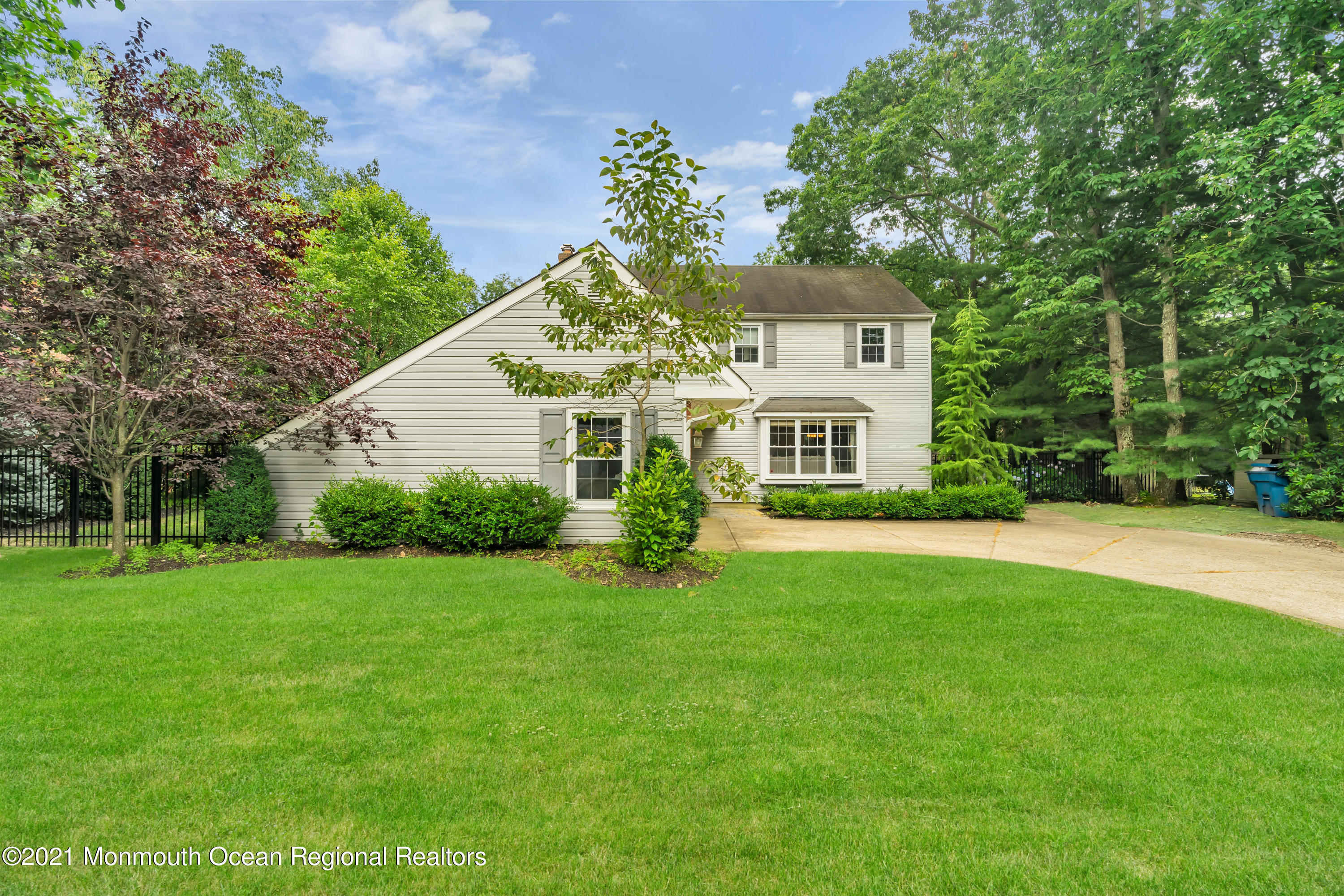 8 Partree Road Jackson, NJ 08527 - Photo 4 of 35 a front view of a house with a garden and trees