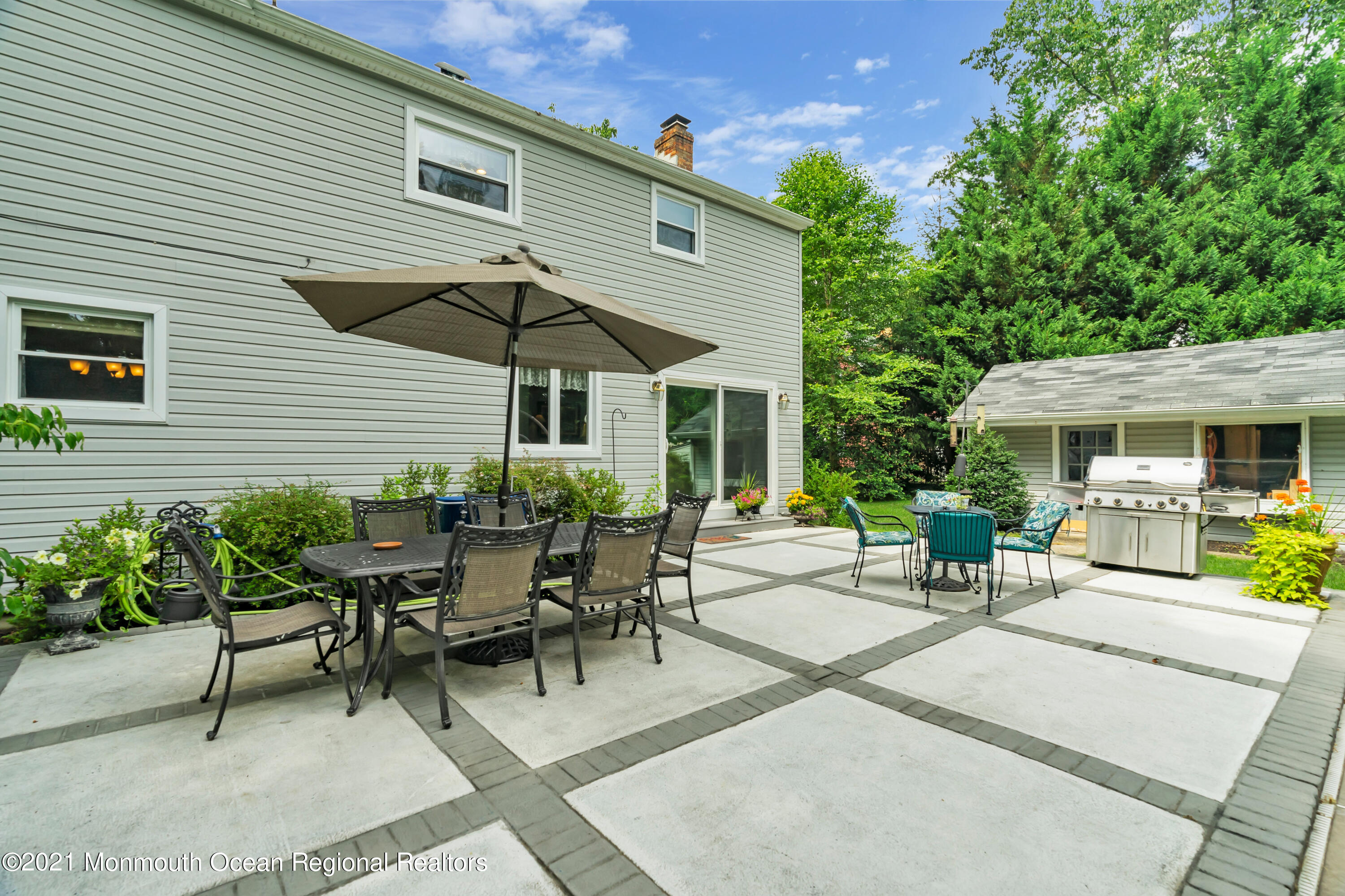 8 Partree Road Jackson, NJ 08527 - Photo 31 of 35 a view of a patio with table and chairs under an umbrella