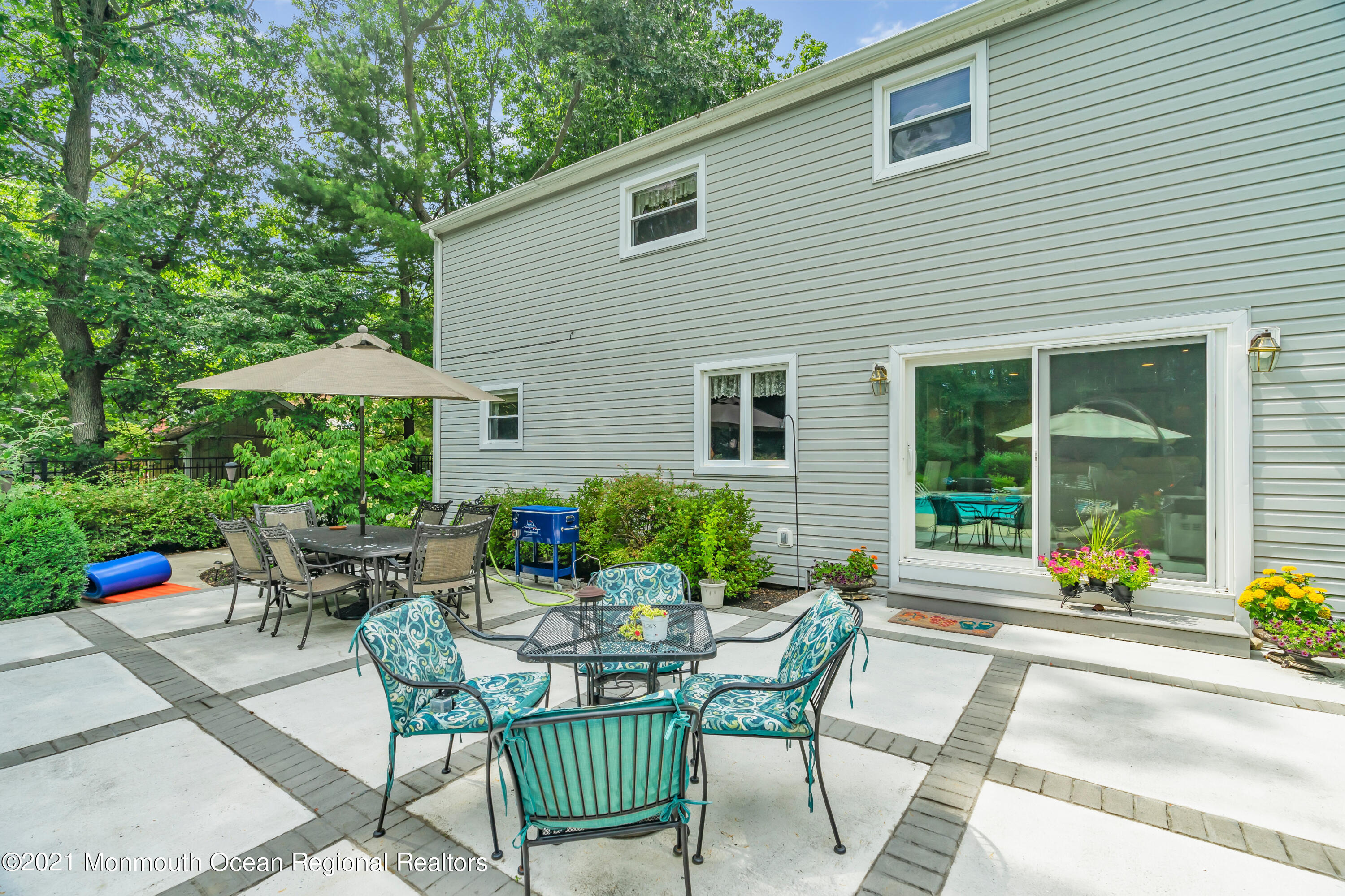 8 Partree Road Jackson, NJ 08527 - Photo 32 of 35 a view of a patio with a table and chairs under an umbrella