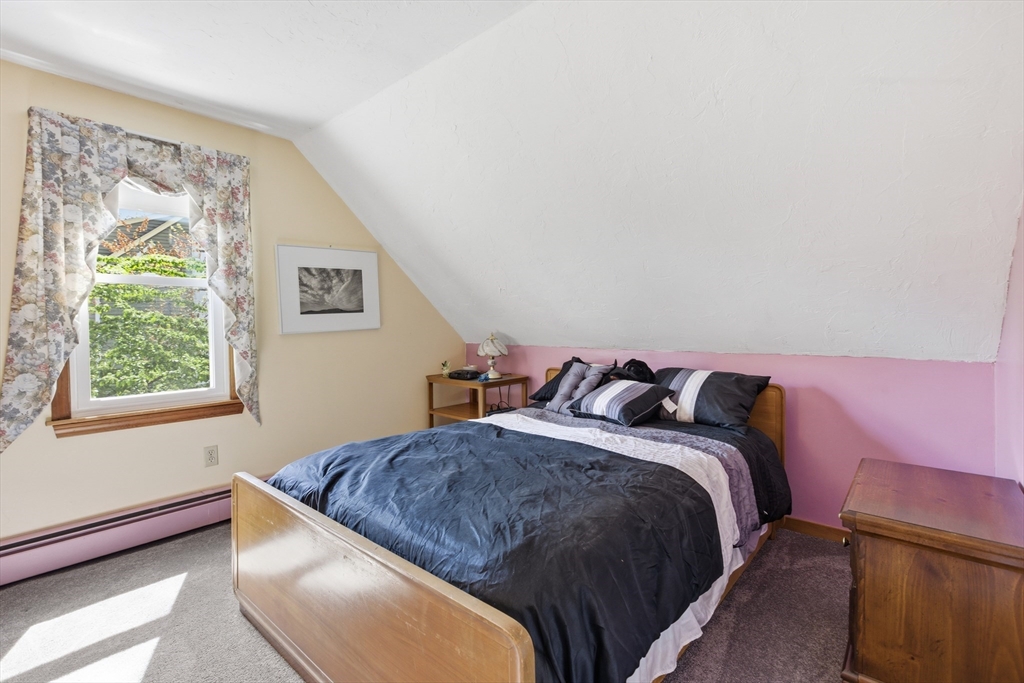 19 Mockingbird Lane Maynard, MA 01754 - Photo 17 of 34 a bedroom with a bed and a window