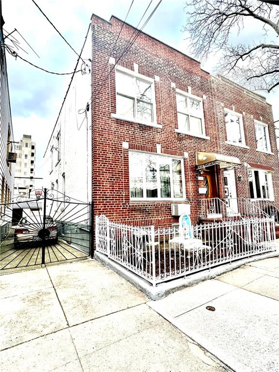 1063 64th Street Brooklyn, NY 11219 - Photo 1 of 20 a view of a brick house with a iron stairs