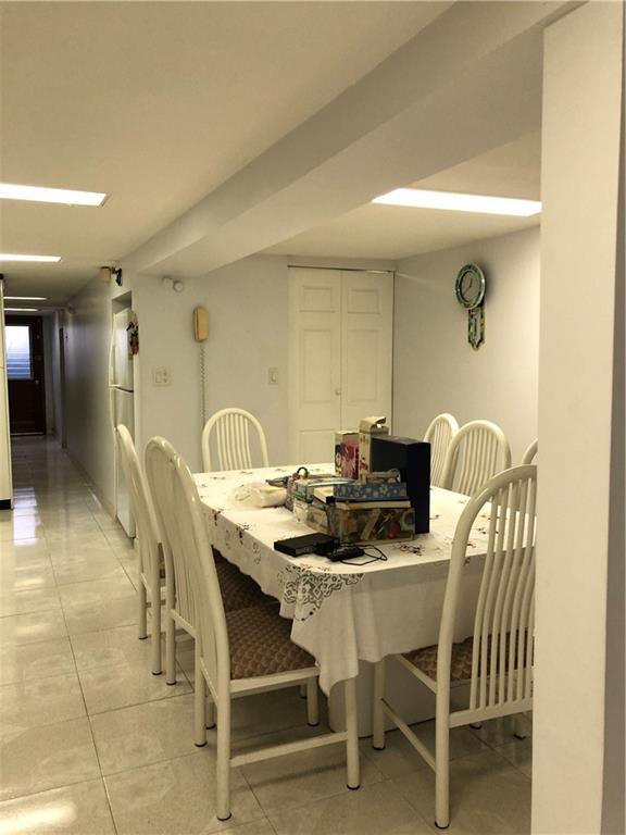1063 64th Street Brooklyn, NY 11219 - Photo 11 of 20 a view of a dining room with furniture