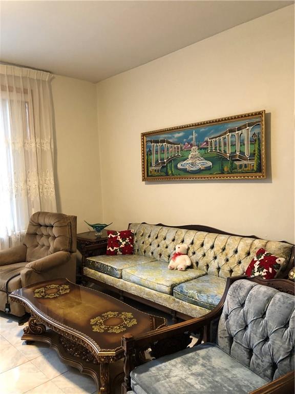 1063 64th Street Brooklyn, NY 11219 - Photo 5 of 20 a living room with furniture