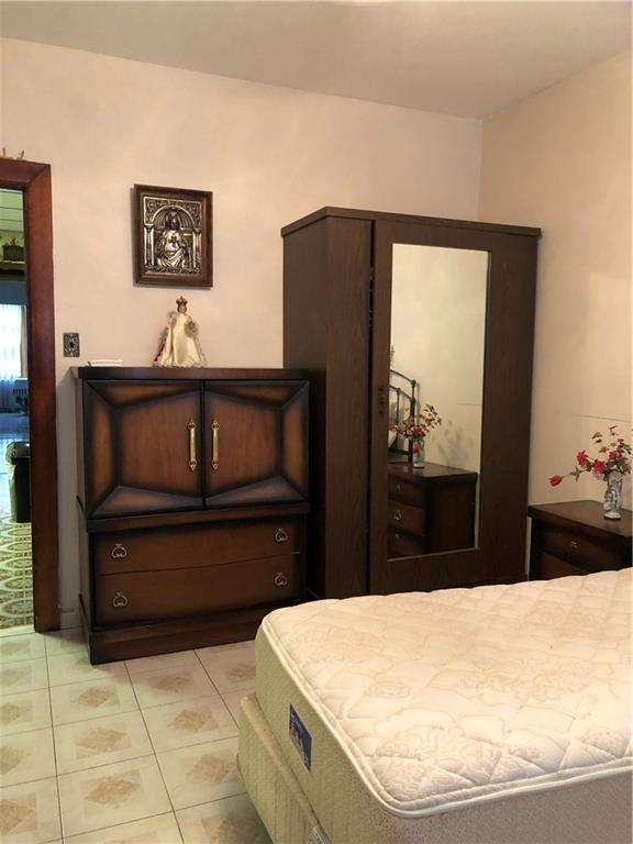 1063 64th Street Brooklyn, NY 11219 - Photo 9 of 20 a bathroom with a sink a vanity and a mirror