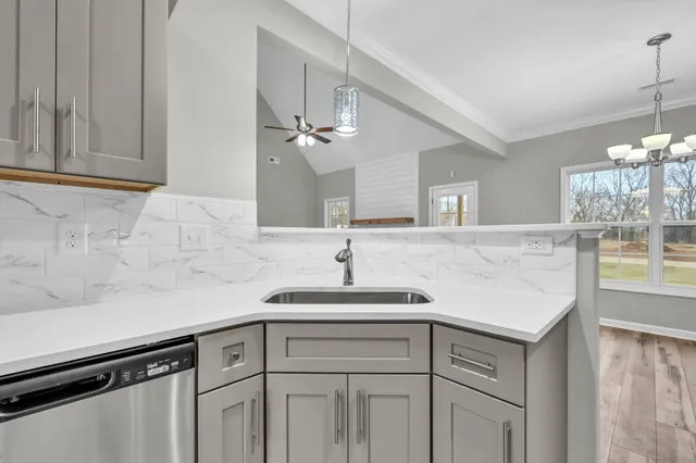 a kitchen with a sink and cabinets