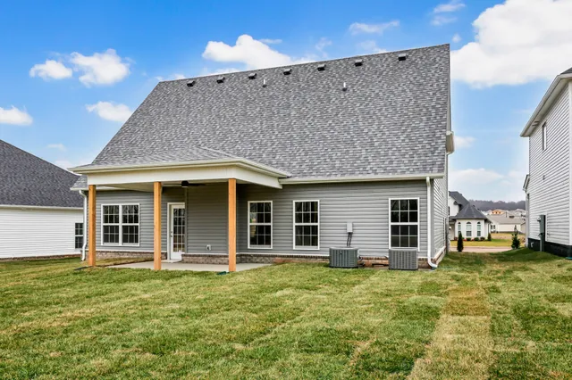 a view of a house with a backyard