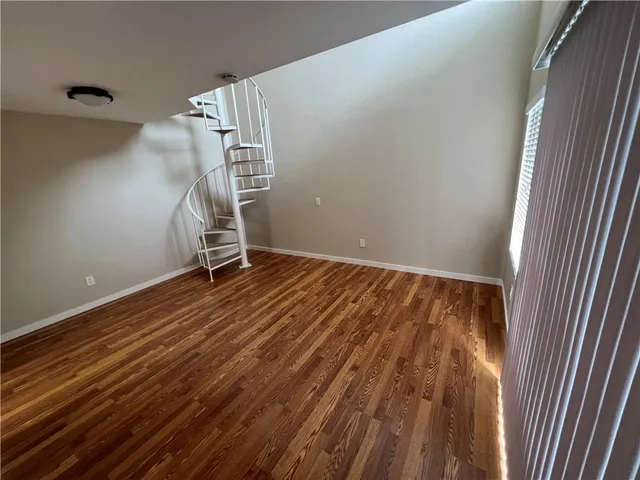 a view of an empty room with stairs