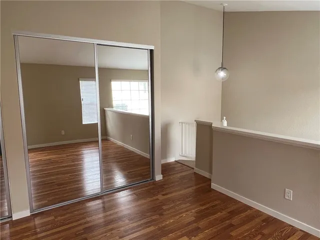 an empty room with wooden floor