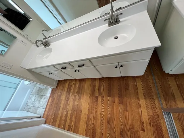 a bathroom with a sink and a mirror