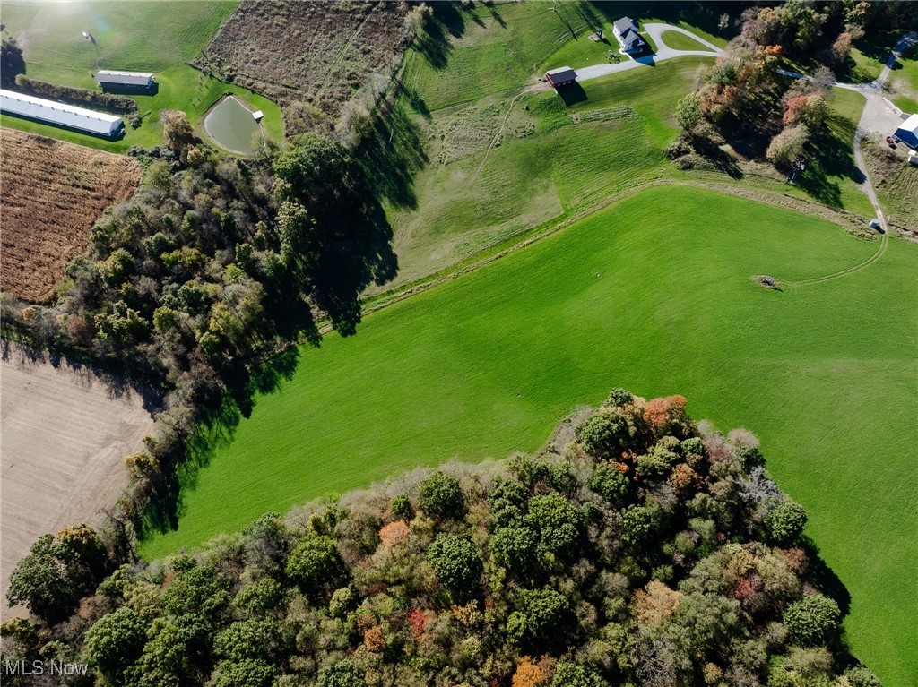 Birds eye view of property with a rural view