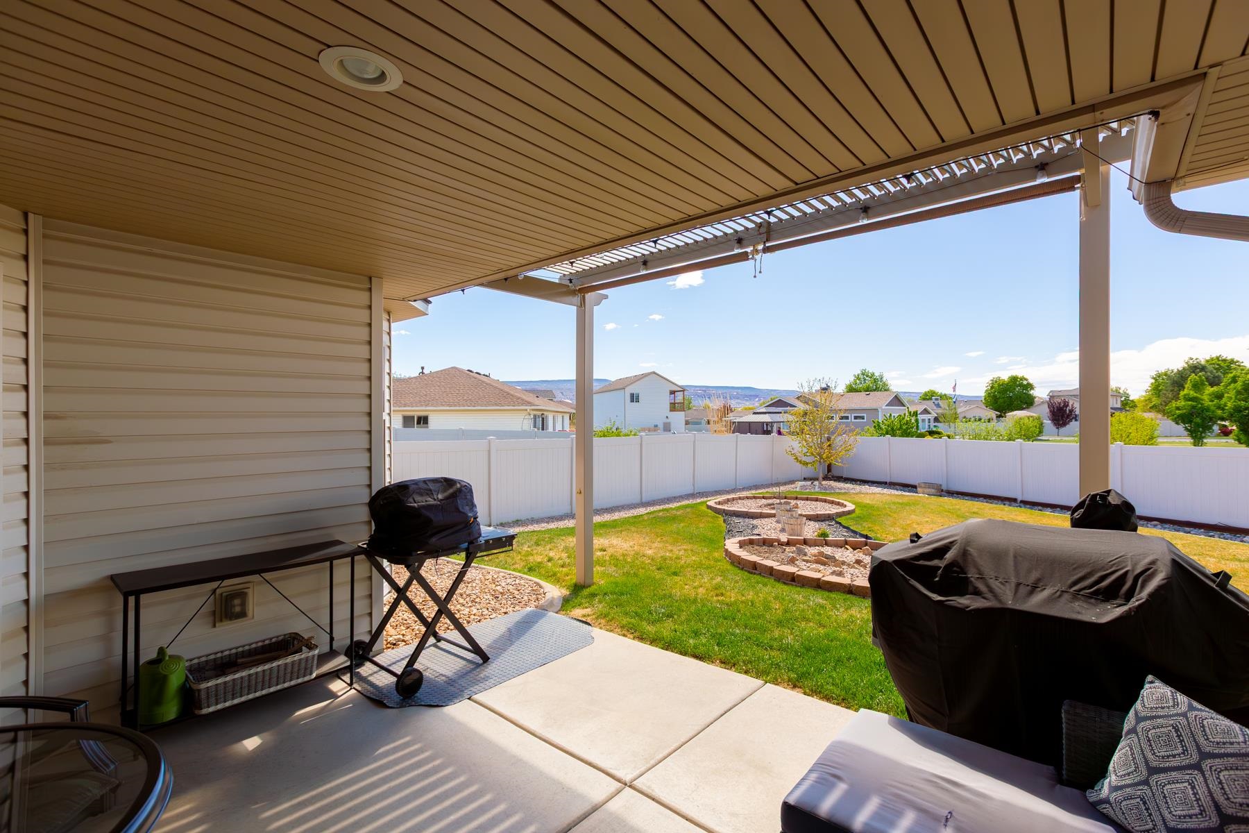 103 Red Rocks Street Fruita, CO 81521 - Photo 15 of 39 a view of a patio with chair and table or chairs
